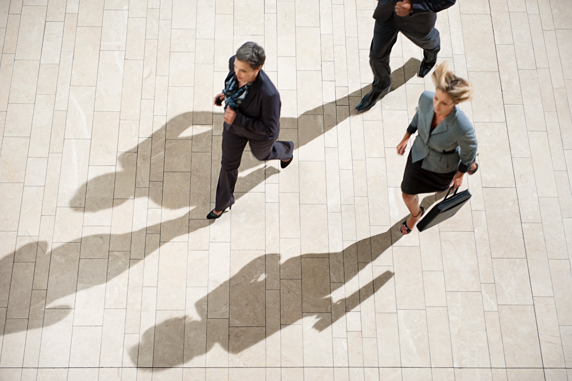 Businesspeople running in lobby